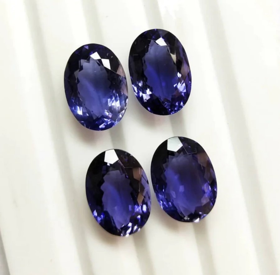 Iolite Faceted Oval 12.2 x 10.1 MM . Eye Clean to Loupe Clean Quality. Very Lustrous. Deep good Color.